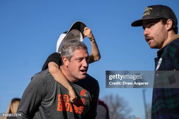 With son Brady on his shoulders, Democratic candidate for U.S. Senate Rep. Tim Ryan talks with Kent State University students on the campus of Kent...