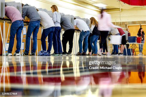 People vote at Denver East High School on November 8, 2022 in Denver, Colorado. After months of candidates campaigning, Americans are voting in the...