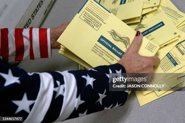 An election worker sorts ballots for the US midterm election, at Mesa County Central Services in Grand Junction, Colorado, on November 8, 2022.