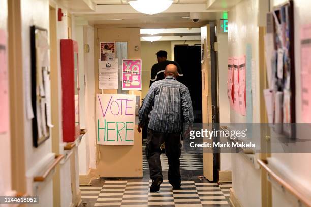 Voters arrive to cast their ballots at the Kendell Arms polling location on November 8, 2022 in Philadelphia, Pennsylvania. After months of...