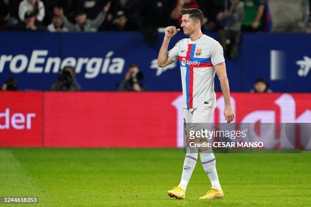 Barcelona's Polish forward Robert Lewandowski reacts as he is expulsed from the pitch after receiving a second yellow card during the Spanish league...