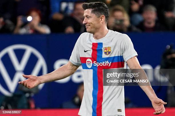 Barcelona's Polish forward Robert Lewandowski reacts as he is expulsed from the pitch after receiving a second yellow card during the Spanish league...