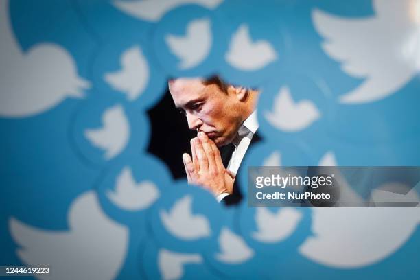 An image of new Twitter owner Elon Musk is seen surrounded by Twitter logos in this photo illustration in Warsaw, Poland on 08 November, 2022.