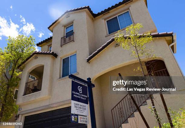 For sale sign is posted in front of a single family house at Beverly Anne Street on June 13 in Las Vegas.