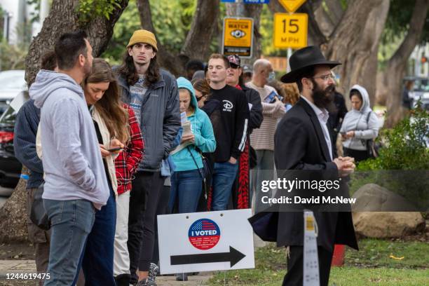 People line up to vote at Plummer Park on November 8, 2022 in West Hollywood, California. After months of candidates campaigning, Americans are...