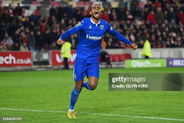 Gillingham's French striker Mikael Mandron celbrates his penalty during a penalty shout-out after during the English League Cup third round football...