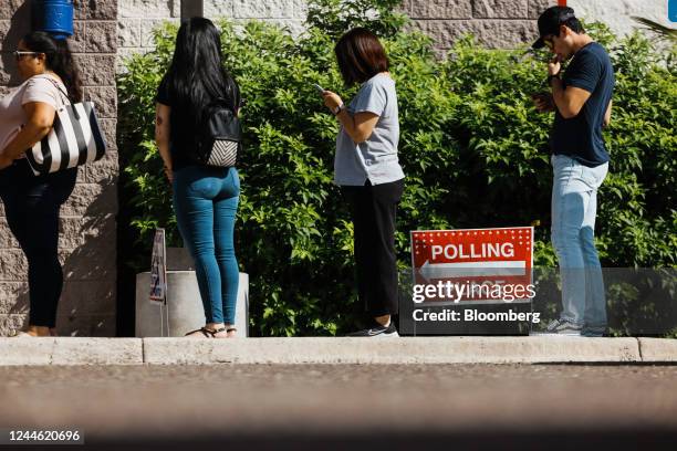 Voters wait in line outside a polling location in McAllen, Texas, US, on Tuesday, Nov. 8, 2022. After months of talk about reproductive rights,...