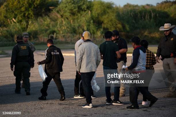 Migrants are detained by border patrol in Eagle Pass, Texas on November 8, 2022.