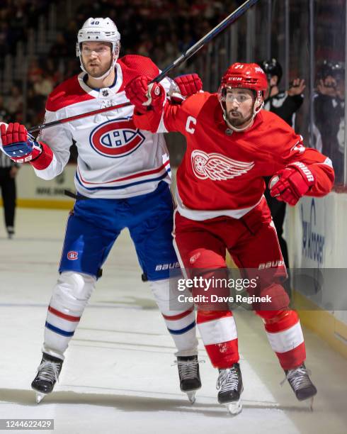 Dylan Larkin of the Detroit Red Wings skates past Joel Armia of the Montreal Canadiens during the first period of an NHL game at Little Caesars Arena...