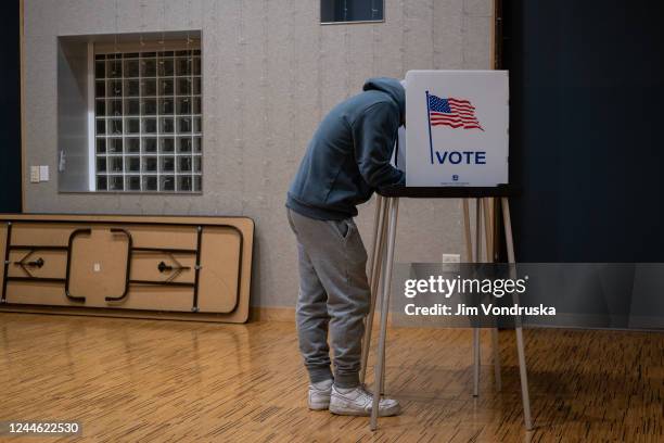 Voter casts their ballot at the Hillel Foundation on November 8, 2022 in Madison, Wisconsin. After months of candidates campaigning, Americans are...