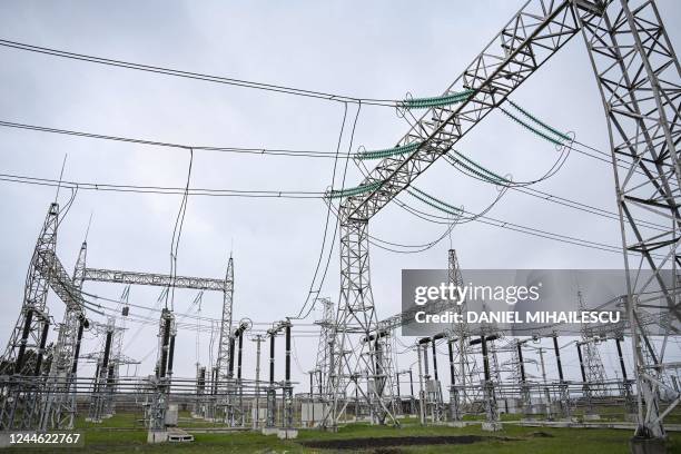 Power lines are pictured at an energy transforming power station in the outskirts of Balti city November 2, 2022. - Faced with being starved of the...