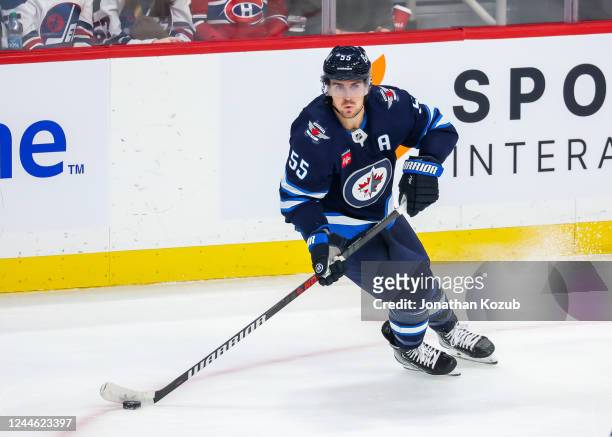 Mark Scheifele of the Winnipeg Jets plays the puck during action in the overtime period against the Montreal Canadiens at Canada Life Centre on...