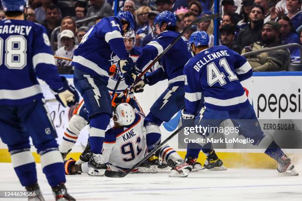 The skate of Pat Maroon of the Tampa Bay Lightning cuts the arm of Evander Kane of the Edmonton Oilers during the second period at Amalie Arena on...