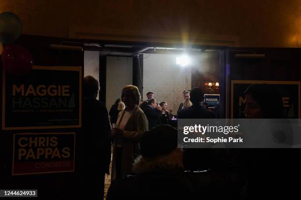 Supporters of Sen. Maggie Hassan and Congressman Chris Pappas wait for results at their election night watch party at the Puritan Conference Center...