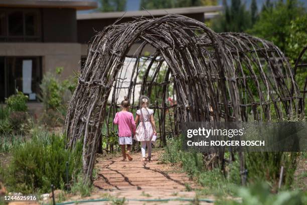 Children walk at the Green School South Africa campus, located close to Paarl, about 60km from Cape Town, on November 7, 2022. - The Green School,...