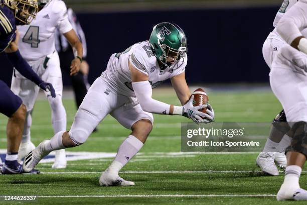 Eastern Michigan Eagles running back Samson Evans recovers his own fumble during the first quarter of the college football game between the Eastern...