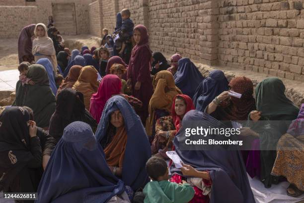 Women wait to see a doctor at a mobile health clinic in Bagrami District, Kabul Province, Afghanistan, on Monday, Oct. 31, 2022. Afghanistan's...
