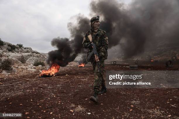 November 2022, Syria, Idlib: A picture made available on 07 November 2022 shows A fighter of Hay'at Tahrir al-Sham opposition militant group...