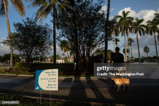 People arrive as the polls open for the midterm elections on November 8, 2022 in Miami Beach, Florida. Turnout is expected to be high across the...