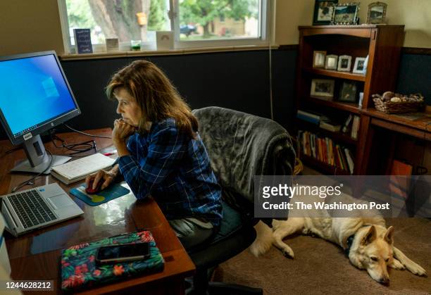 August 16, 2022: Indivisible activist Robin Kupernick works from home, with her dogs always near, in Arvada, Colorado Tuesday August 16, 2022.