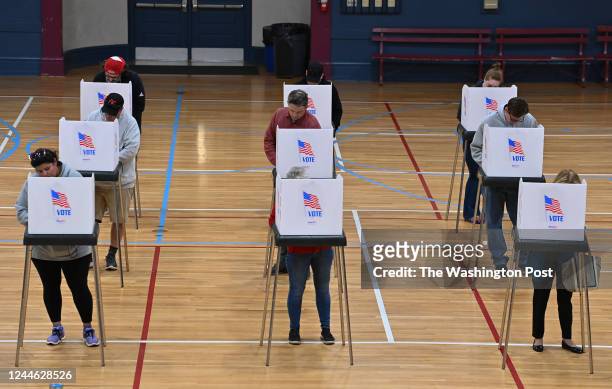 Voters fill out their ballots before casting their votes during the mid-term elections at the William R. Talley Recreation Center on November 8, 2022...