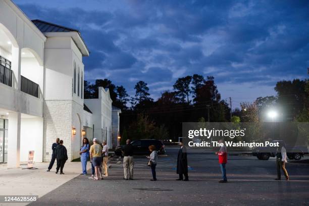 Voters wait in line to vote at Worship With Wonders Church in Marietta, Ga., on Tuesday, Nov. 8, 2022.