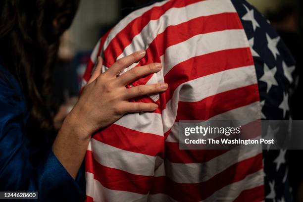 Anna Paulina Luna, the Republican candidate in Florida's 13th Congressional District, touches the shoulder of a supporter at her election night party...