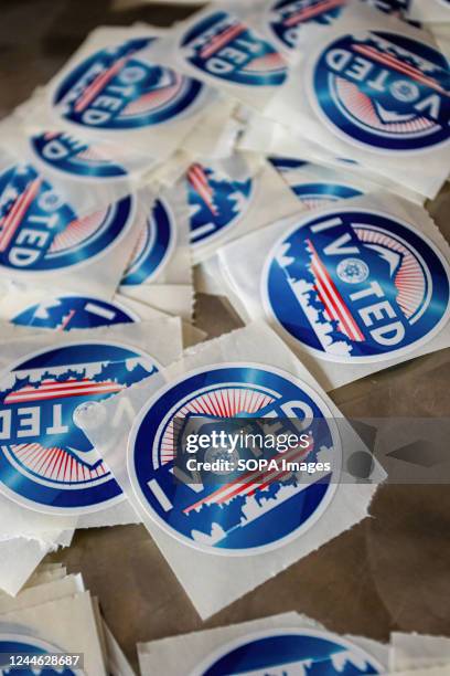 Voted" stickers are seen during the election day. Despite the winter storm, election day in Nevada continues, and voters remain busy casting their...