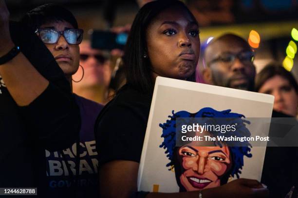 November 7, 2022: Attendees listens to Candidate for Governor of Georgia Stacey Abrams deliver remarks during "Let's Get It Done" Get Out To Vote...