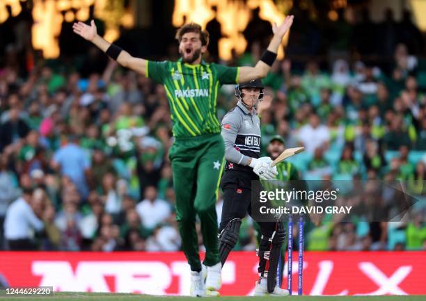 New Zealand's Finn Allen looks on as Pakistan's Shaheen Shah Afridi makes a successfull appeal for a leg before wicket decision against him during...