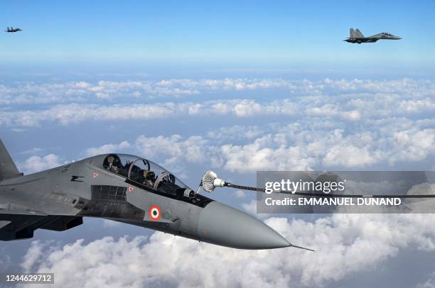 Indian Air Force Sukhoi Su-30MKI fighter jets take part in an air refueling exercise from a French Air and Space Force Airbus A330 Multi Role Tanker...