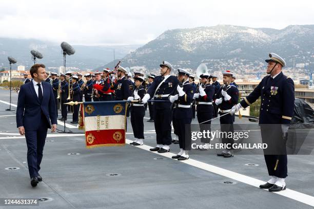 France's President Emmanuel Macron walks on the deck of the amphibious helicopter carrier Dixmude docked in the French Navy base of Toulon, Southern...