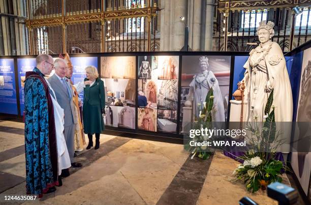 King Charles III and the Camilla, Queen Consort are shown a scaled replica of the statue of Queen Elizabeth II that they will unveil later during a...