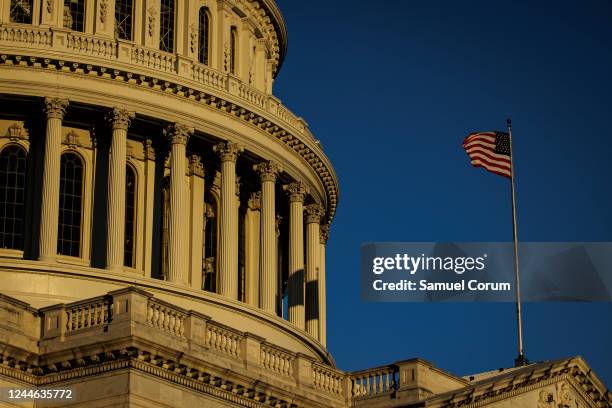 The US Capitol building is illuminated by the rising sun on November 9, 2022 in Washington, DC. Americans participated in the midterm elections to...