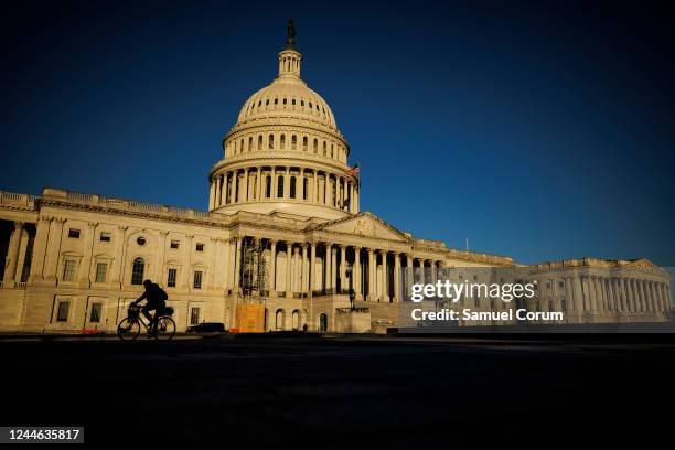 The rising sun illuminates the US Capitol building on November 9, 2022 in Washington, DC. Americans participated in the midterm elections to decide...