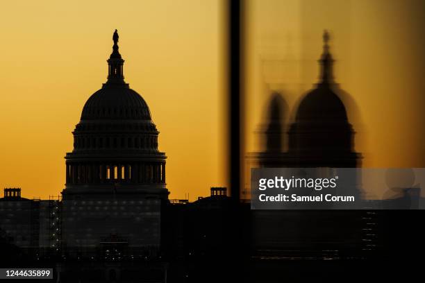 The US Capitol dome is seen from the base of the Washington Monument as the sun rises on November 9, 2022 in Washington, DC. Americans participated...