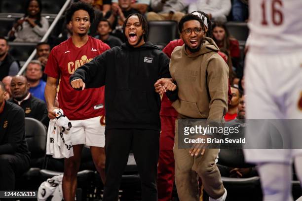Darius Garland of the Cleveland Cavaliers celebrates from the bench against the Detroit Pistons on November 4, 2022 at Little Caesars Arena in...