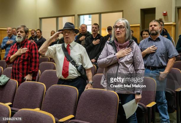 Shasta County residents Bert Stead, foreground, center, and Bev Gray, foreground, right, are photographed with others during the pledge of allegiance...