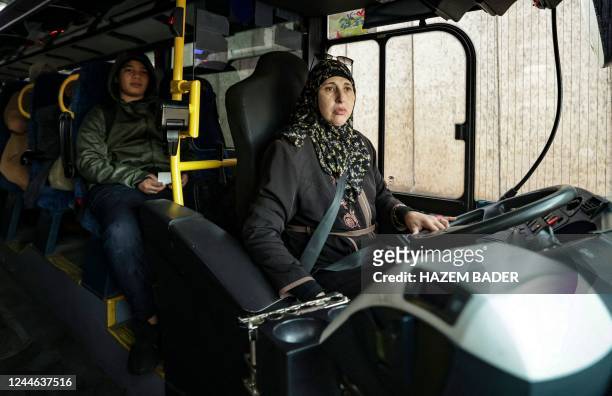 Samia Abu-Alqam, a 50-year-old Palestinian woman, drives a bus in Israeli-annexed east Jerusalem, on November 9, 2022. - Abu- Alqam is the only known...