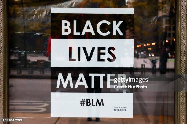 Black Lives Matter poster is seen in a window of MacArthur Foundation in Chicago, Illinois, United States, on October 18, 2022.