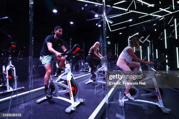 General view as people exercise at Crank Fit - Dubai Indoor Cycling & Boutique Fitness Studio on June 04, 2020 in Dubai, United Arab Emirates....