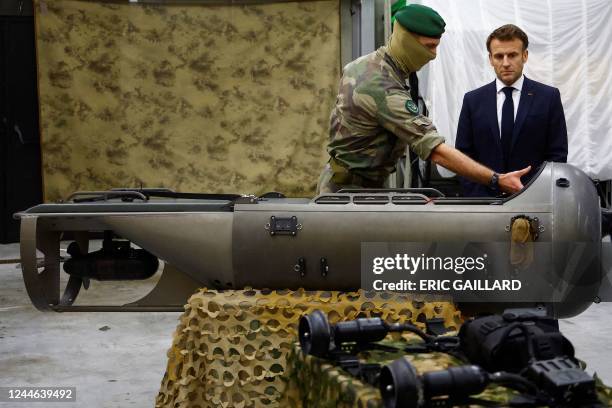 French President Emmanuel Macron speaks with a soldier of the French Commando Hubert, a special forces unit of the French Navy, in...