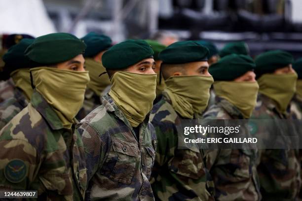 Soldiers of the French Commando Hubert, a special forces unit of the French Navy, wait prior to the arrival of French President in...