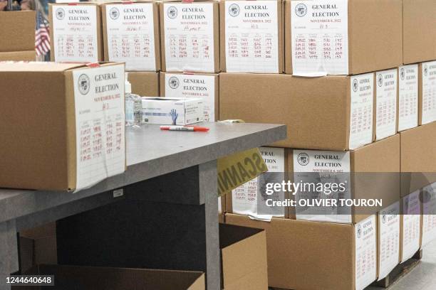 Ballots yet to be counted sit at the Maricopa County Tabulation and Elections Center in Phoenix, Arizona, on November 9, 2022. - Officials in an...