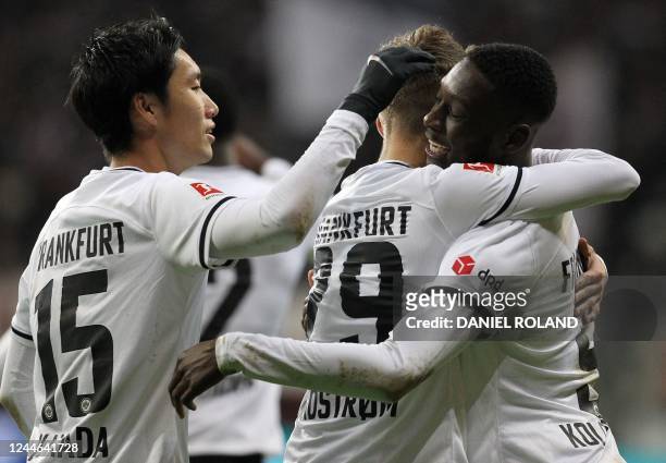 Frankfurt's French forward Randal Kolo Muani is celebrated by teammates for scoring the 2-0 during the German first division Bundesliga football...