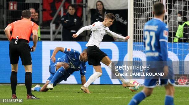 Frankfurt's Danish midfielder Jesper Lindstrom shoots to score the 4-2 goal during the German first division Bundesliga football match between...