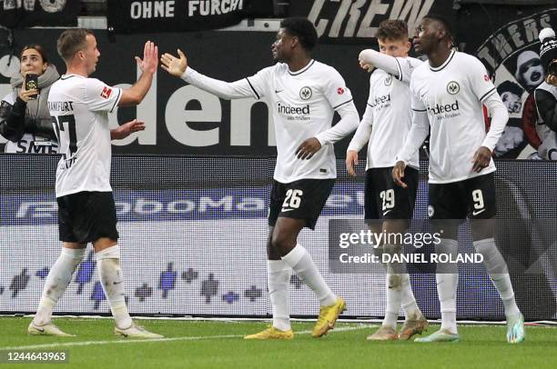 Frankfurt's Danish midfielder Jesper Lindstrom celebrates scoring the 4-2 goal with Frankfurt's French forward Randal Kolo Muani , Frankfurt's German...
