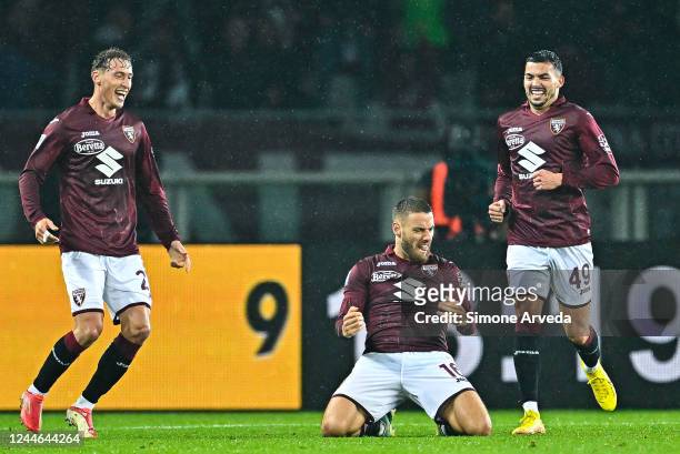Nikola Vlasic of Torino celebrates with his team-mates Mergim Vojvoda and Nemanja Radonjic after scoring a goal during the Serie A match between...
