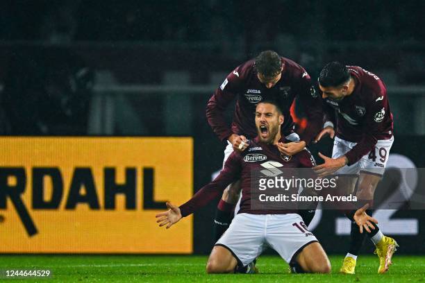 Nikola Vlasic of Torino celebrates with his team-mates Mergim Vojvoda and Nemanja Radonjic after scoring a goal during the Serie A match between...