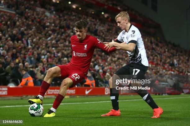 Calvin Ramsey of Liverpool and Louie Sibley of Derby during the Carabao Cup Third Round match between Liverpool and Derby County at Anfield on...